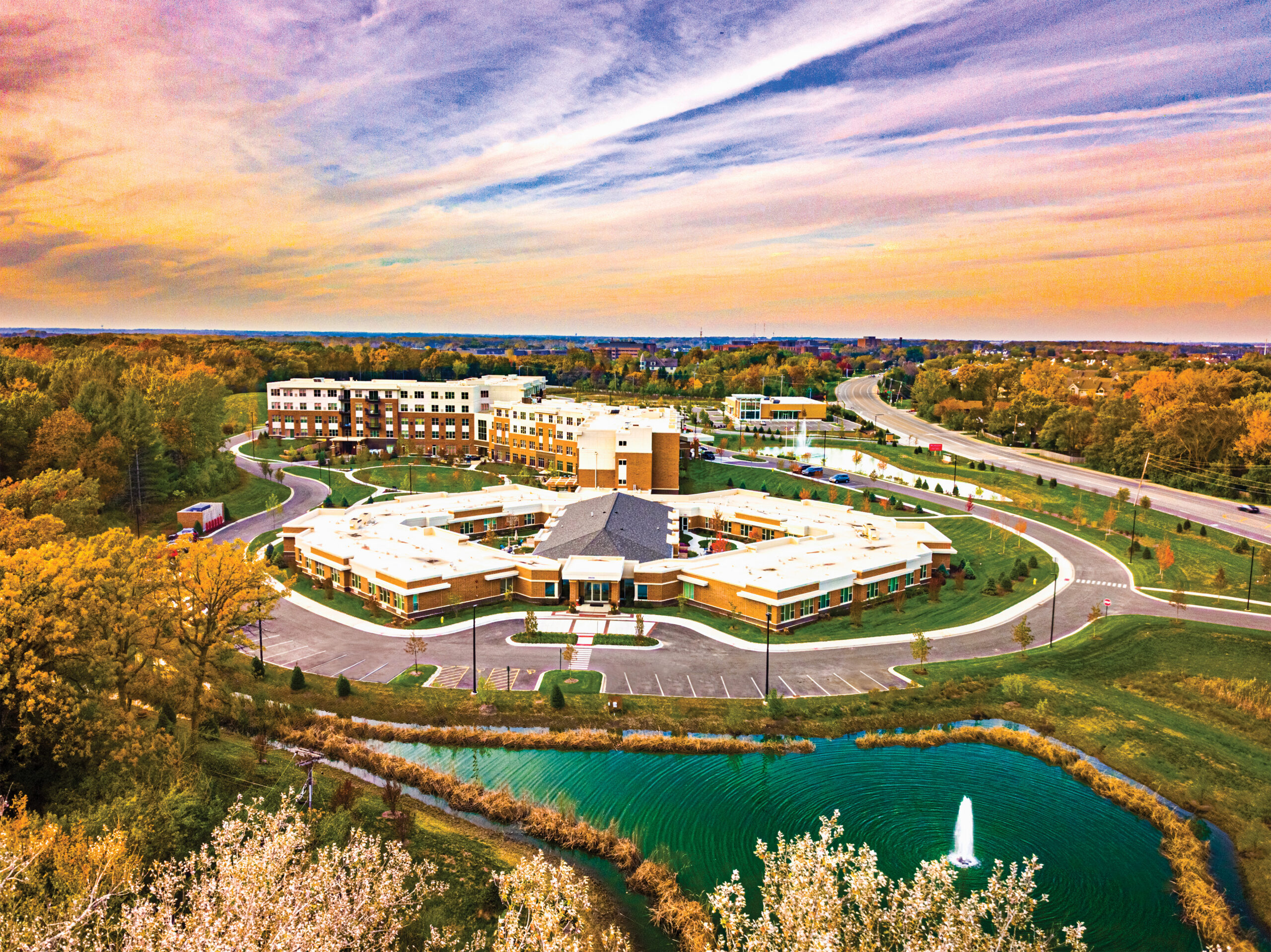 Wide Exterior View Of Modena Green Oaks Facility At Dusk.