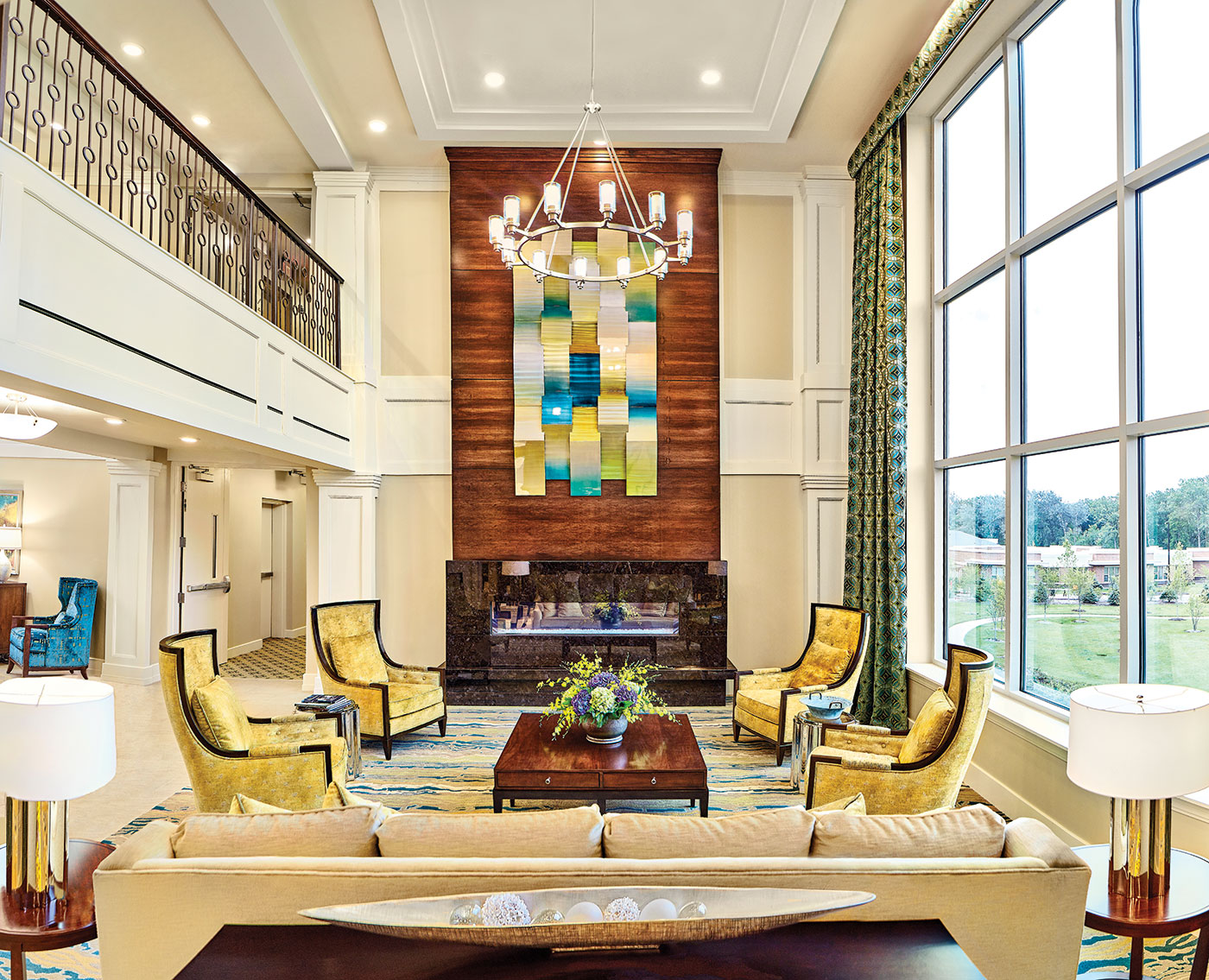 Spacious Great Room With Fireplace And Large Windows At Modena Green Oaks.